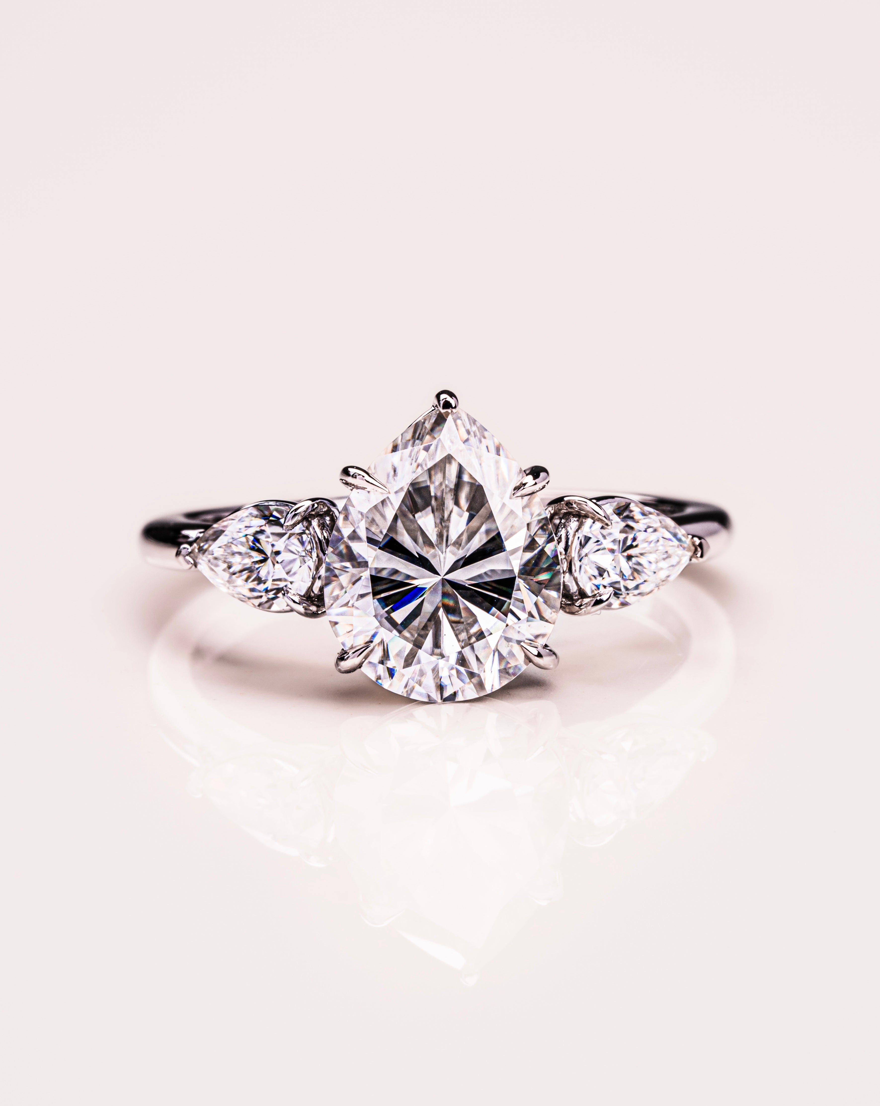 3.09 CT Pear Cut Three Stone Moissanite Engagement Ring 1