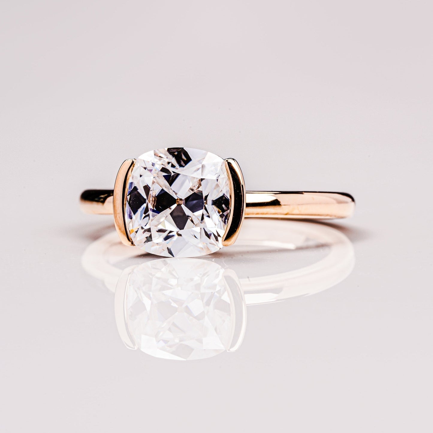 Cushion Solitaire & Half Bezel Moissanite Engagement Ring