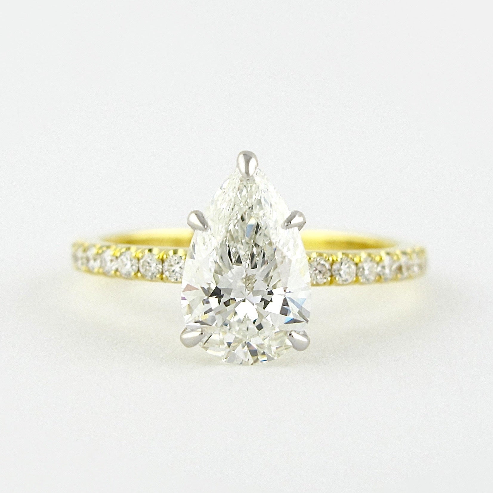 0.94 CT Pear Solitaire & Pave Setting Moissanite Engagement Ring 1