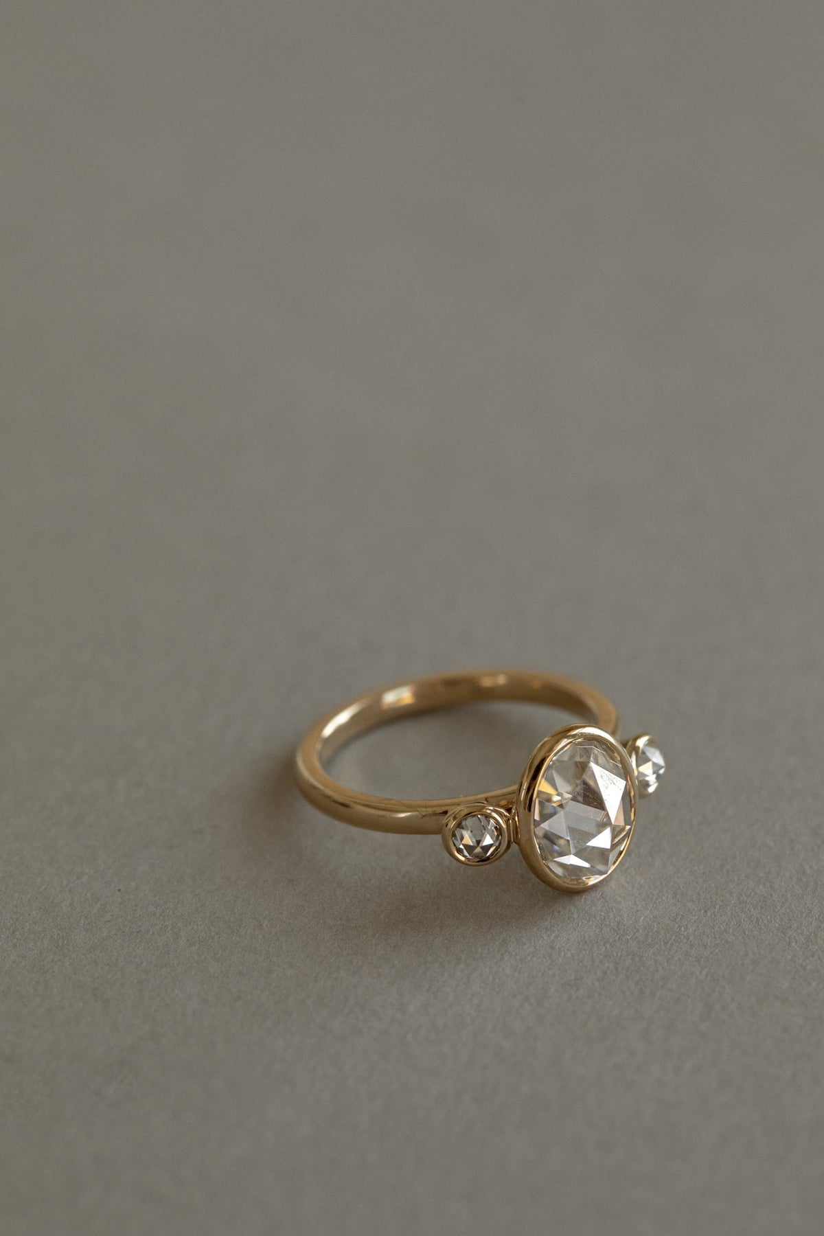 2.31 CT Oval Three Stone Bezel Lab Grown Diamond Engagement Ring with Round Diamond Accents