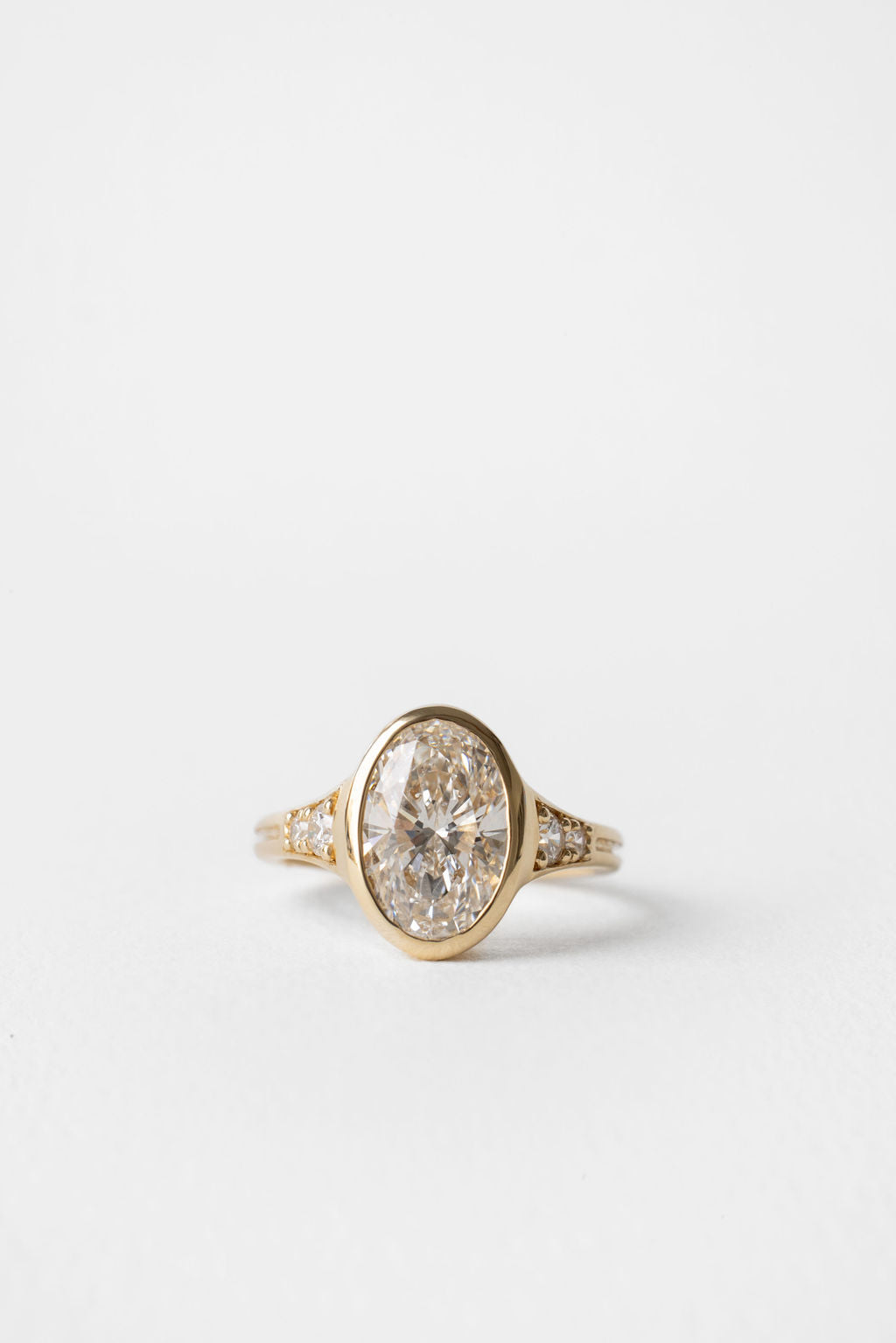 2.00 CT Round Bezel Pavé Lab Grown Diamond Engagement Ring with Oval Diamond Accents