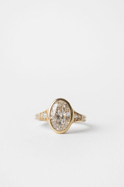 2.00 CT Round Bezel Pavé Lab Grown Diamond Engagement Ring with Oval Diamond Accents