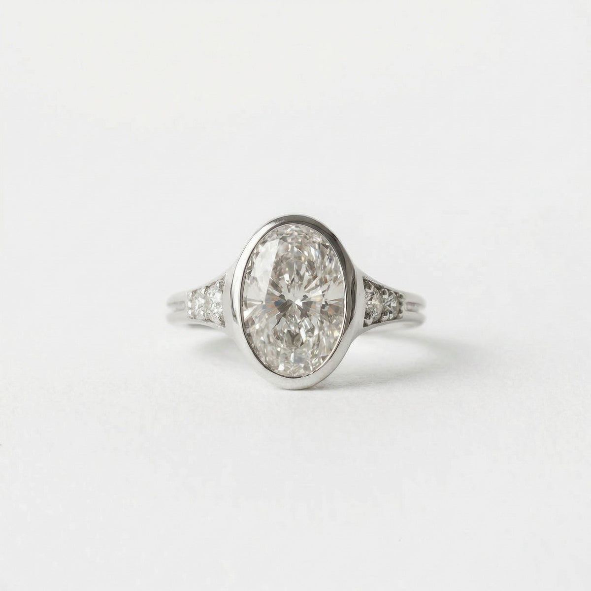 2.00 CT Round Bezel Pavé Lab Grown Diamond Engagement Ring with Oval Diamond Accents