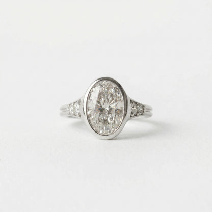 2.00 CT Round Bezel Pavé Lab Grown Diamond Engagement Ring with Oval Diamond Accents