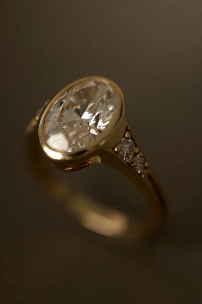 2.00 CT Round Bezel Pavé Lab Grown Diamond Engagement Ring with Oval Diamond Accents